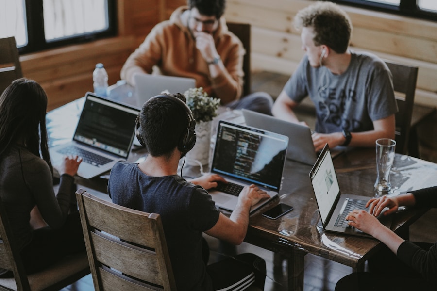 A team of software developers collaborating around laptops